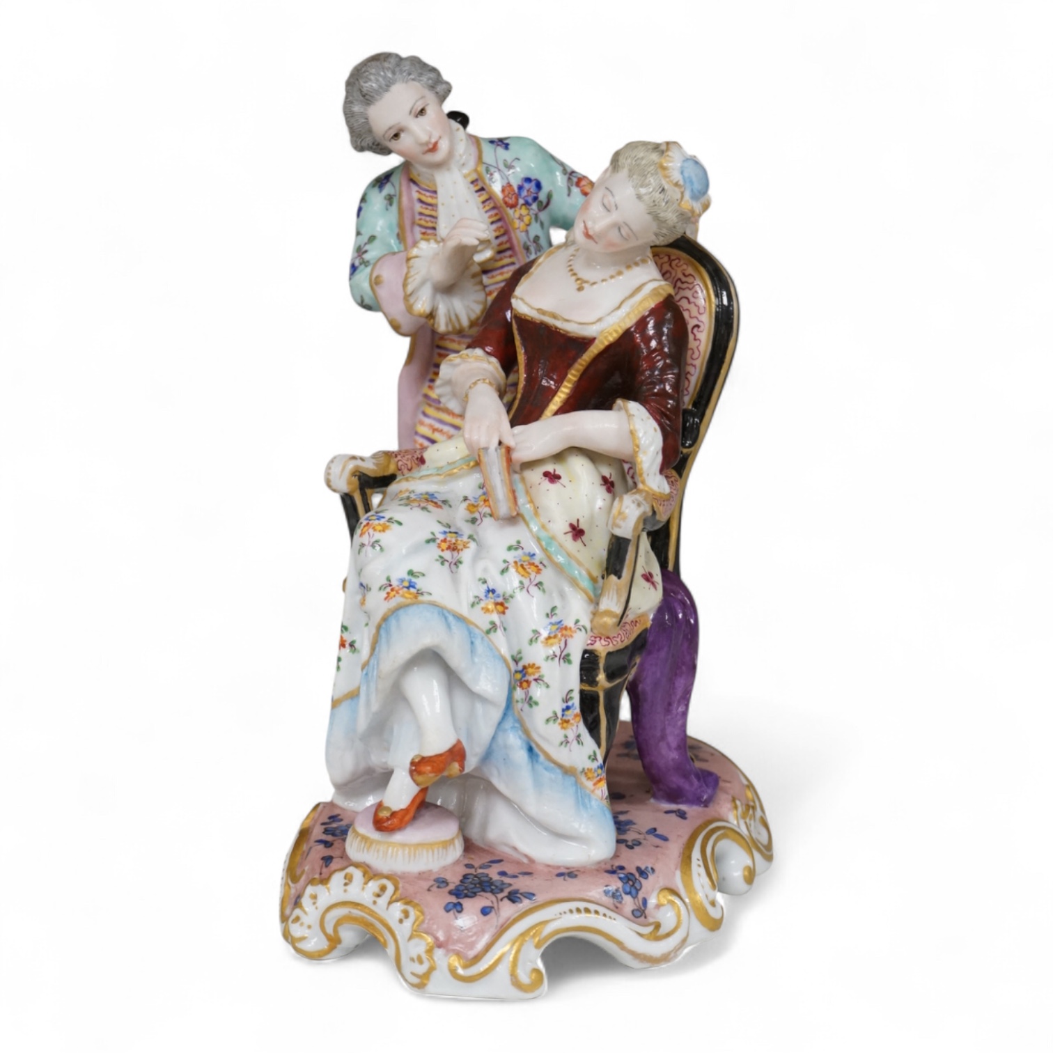 A German porcelain group of a seated sleeping beauty, 21cm high